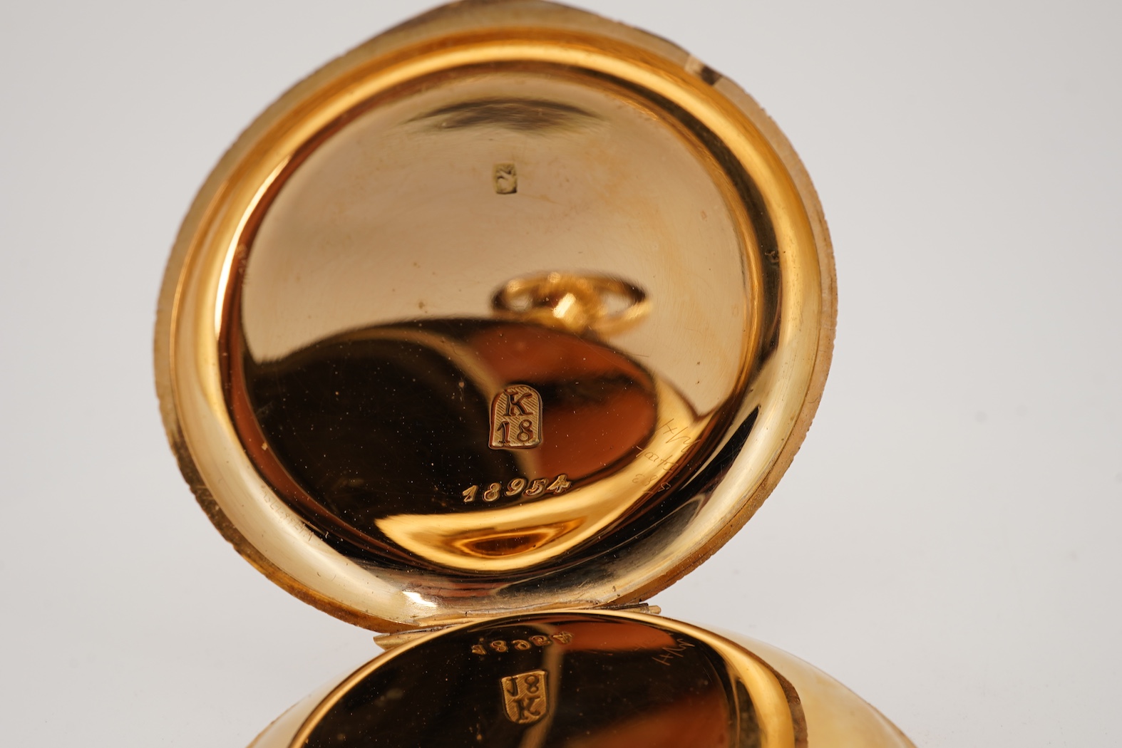 A lady's early 20th century Swiss engraved 18k open faced keyless fob watch